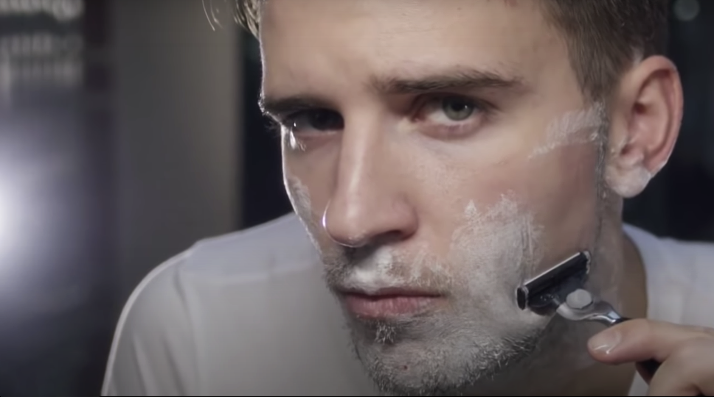 Man shaving face with Czech & Speake razor