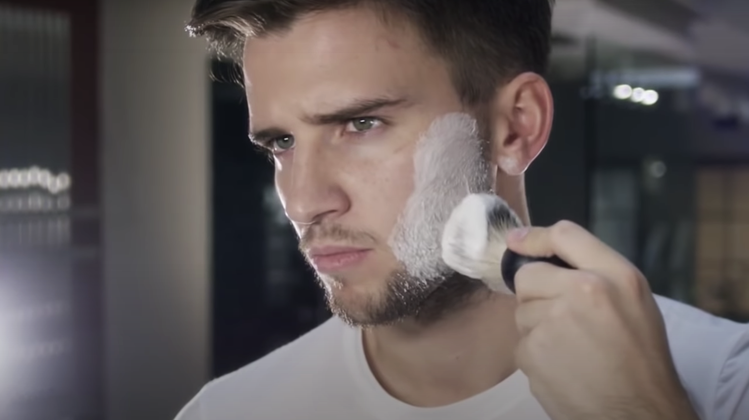 Man lathering shaving soap over face with Czech & Speake No.88 Shaving Soap