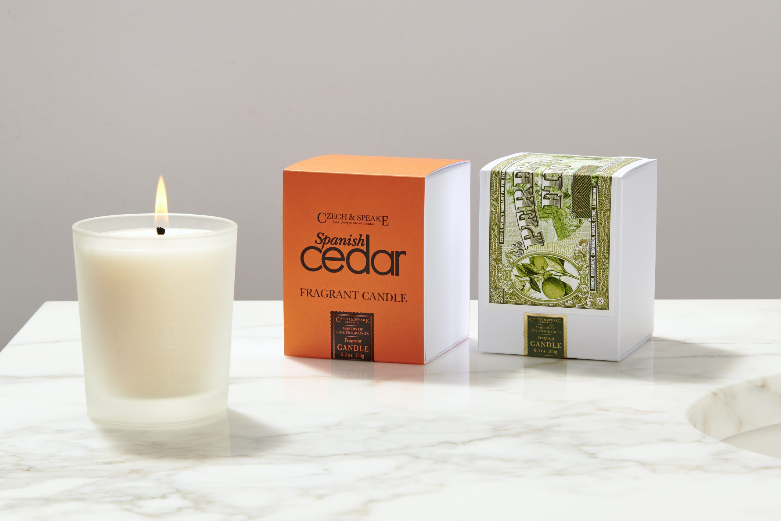 Czech & Speake candle in frosted glass with Spanish Cedar and Perfecto Fino packaging on marble surface.