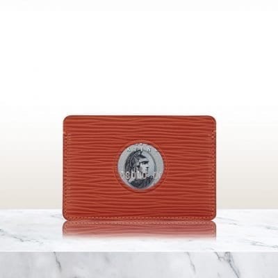 Single Cut Out Card Holder in red leather on marble surface