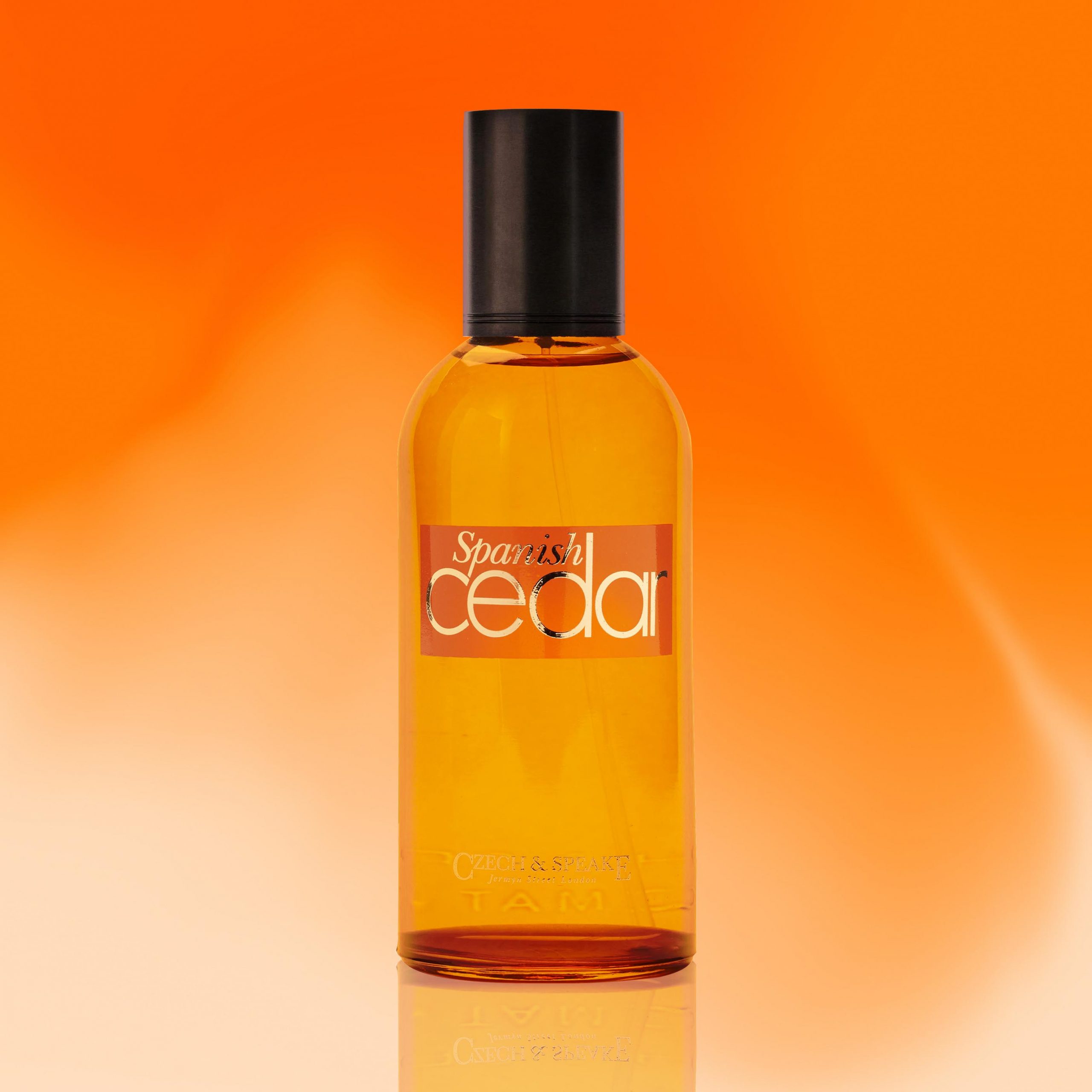 Orange background with amber Spanish Cedar bottle 100ml