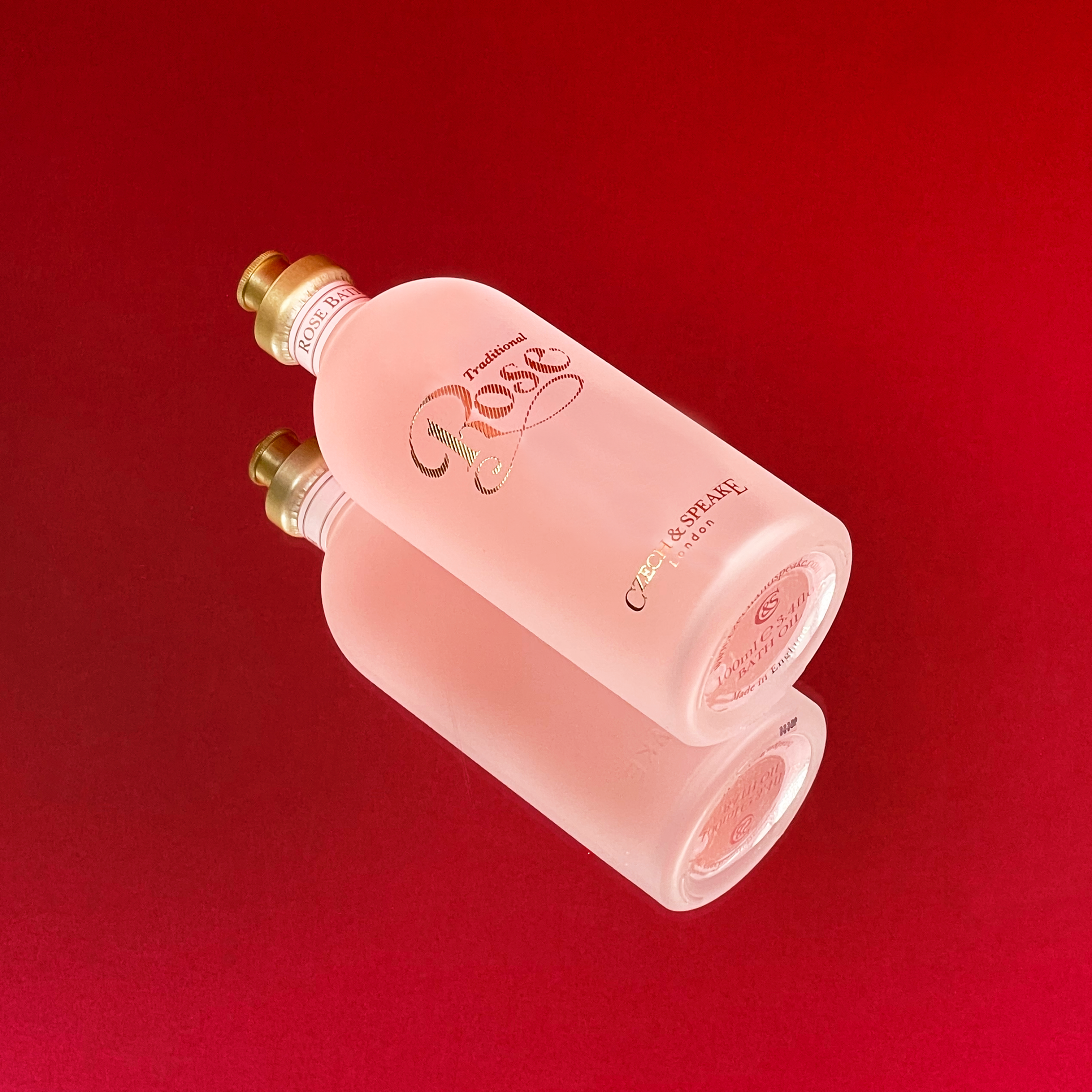 Rose Bath Oil 100ml on red mirrored background