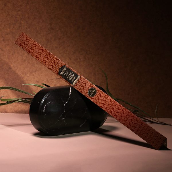 Incense stick box leaning on decoration